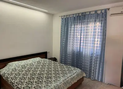 a bedroom with a bed and a window at Studio apartmani DENNUS in Bar