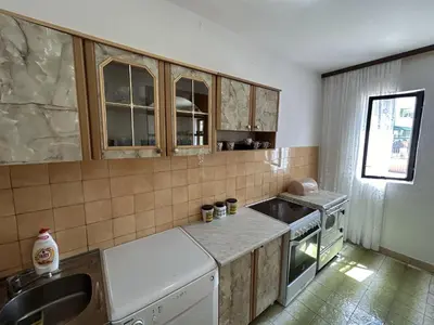 a small kitchen with a sink and a stove at Apartments TODOR in Bar