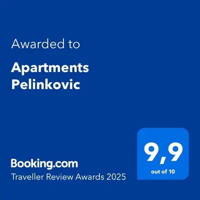 a blue sign with the text awarded to applicants pelhovhovookie at Apartments Pelinkovic in Ulcinj