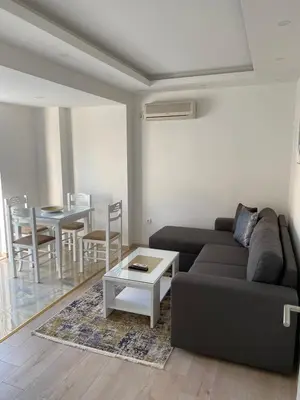 a living room with a couch and a table at Ceka Apartments in Ulcinj