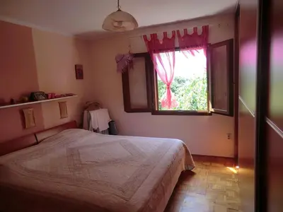 a bedroom with a bed and a window at Holiday Home Hermes in Budva