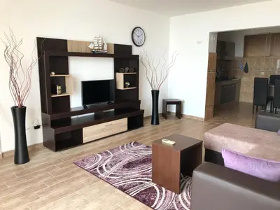 a living room with a television and a couch at Apartment Jana in Ulcinj