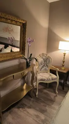 a bedroom with a desk and a chair and a mirror at Apartment Dmitr Petrovac in Petrovac na Moru