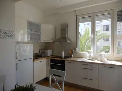 a kitchen with white appliances and a white refrigerator at Summer apartment in Bar