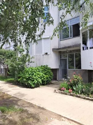 a white house with a driveway in front of it at Summer apartment in Bar