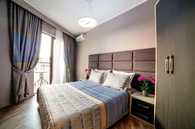 a bedroom with a large bed and a window at Hotel Princess & Spa in Ulcinj