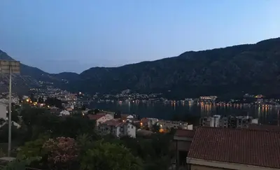 a city with a view of a town and a body of water at Apartment Apollo in Kotor