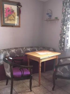 a table and two chairs and a couch at Apartment Aleksandra in Bar