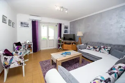 a living room with a couch and a table at Apartment Stanko in Pržno