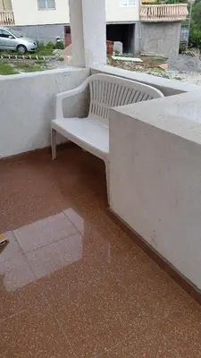 a white bench sitting on top of a wall at Apartment Oaza in Bar