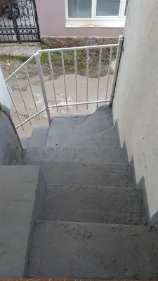 a set of concrete stairs with a metal railing at Apartment Oaza in Bar