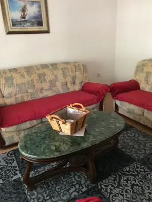 a living room with a couch and a coffee table at Apartment K2 in Radanovići