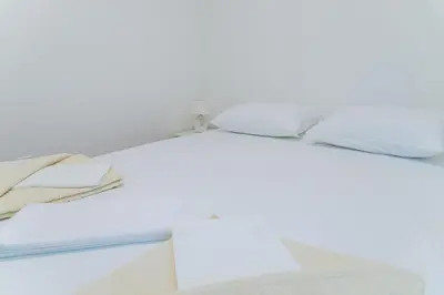 a shelf with folded towels on it at Apartment Blue Adriatic in Budva