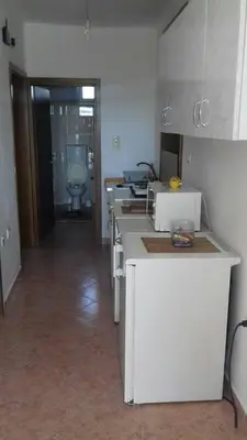 a kitchen with a row of sinks and a toilet at Anika apart in Bar