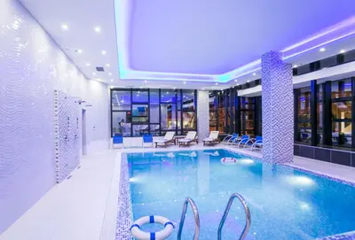 a large swimming pool in a hotel room at Hotel Ulliri & SPA in Ulcinj