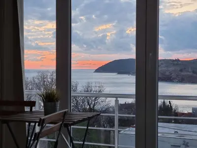 a view of the ocean from a window at IN Villa Guesthouse in Sutomore