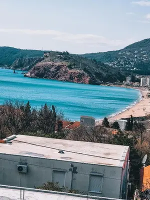 a view of a beach and the ocean at IN Villa Guesthouse in Sutomore