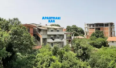 a building with a sign that reads apartment rap at Apartmani RAR in Dobra Voda