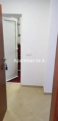a room with a door and a tile floor at Apartmani Nikmil Bar- Šusanj in Bar