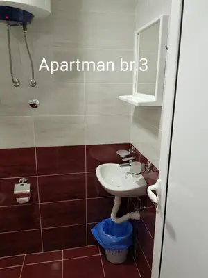 a bathroom with a sink and a mirror at Apartmani Nikmil Bar- Šusanj in Bar