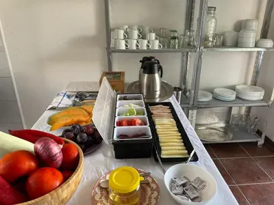 a table with a bunch of fruits and vegetables at OSA Holiday in Ulcinj
