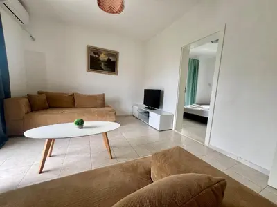 a living room with a couch and a table at OSA Holiday in Ulcinj