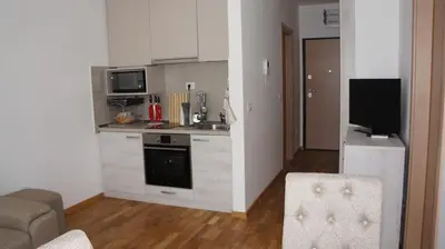a kitchen with a stove and a counter top at Apartments LORA Bokeljske brigade in Budva