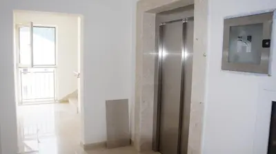 a stainless steel refrigerator in a room with a window at Apartments LORA Bokeljske brigade in Budva