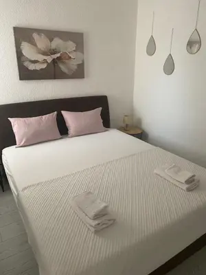 a bedroom with a bed with two towels on it at Apartment Tijana in Bar