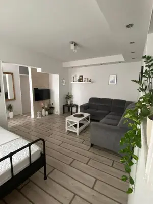 a living room with a couch and a table at Apartment Tijana in Bar