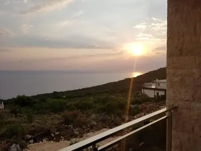 a view of the ocean from the balcony of a house at Apartment Vila Mirela in Krimovice