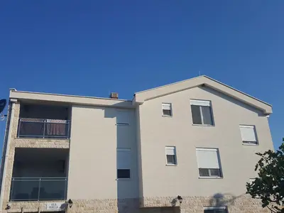 an apartment building with a blue sky in the background at Apartment Vila Mirela in Krimovice