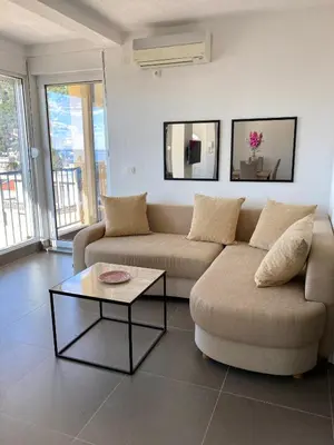 a living room with a couch and a coffee table at Villa Casanego in Sutomore