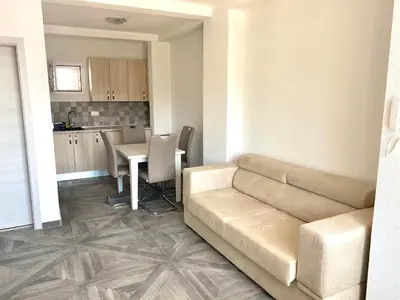 a living room with a couch and a table at Villa Casanego in Sutomore