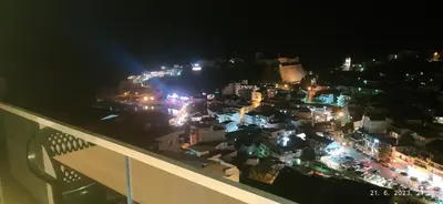 a view of a city at night with lights at Apartments Radoman in Ulcinj
