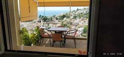 a table and chairs on a balcony with a view at Apartments Radoman in Ulcinj