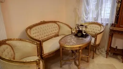 two chairs and a table in a room at Apartments Renaissance Old town in Budva