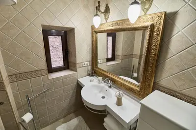 a bathroom with a sink and a mirror at Apartments Renaissance Old town in Budva