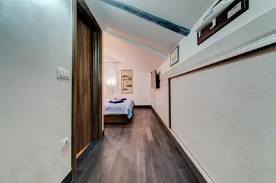 a corridor of a room with a bed and a door at Castelomi in Podgorica