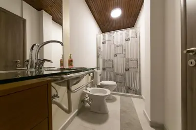 a bathroom with a toilet and a shower at Castelomi in Podgorica
