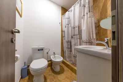 a bathroom with a toilet and a sink at Castelomi in Podgorica