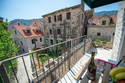 a view from the balcony of an old building at Katareo Apartments in Kotor