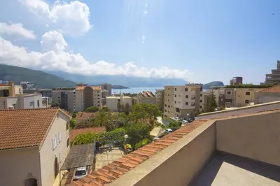 a view of a city from the roof of a building at Astor apartments in Budva