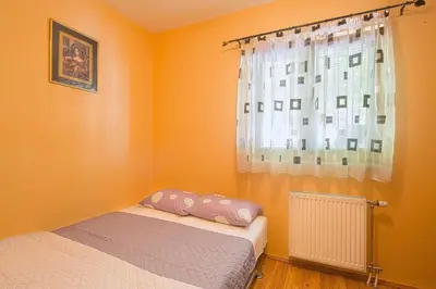 a bedroom with two beds and a window at Astor apartments in Budva