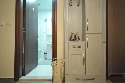 a hallway with a door with a cat figurine in it at Lux Apartments MMS in Budva