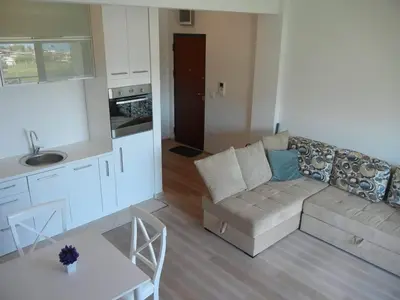 a living room with a couch and a table at Apartment More in Budva