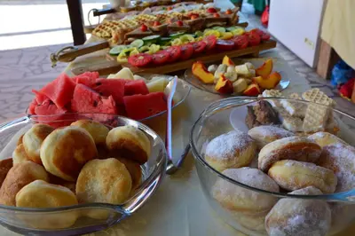 a buffet of different types of food on a table at Guest House Vera in Ulcinj