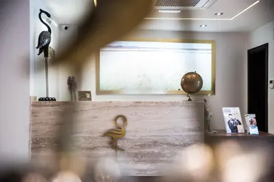 a figurine of a man on a wall in a room at Boutique Hotel 