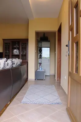 a living room with a couch and a door at Holiday Home Gazevic in Virpazar