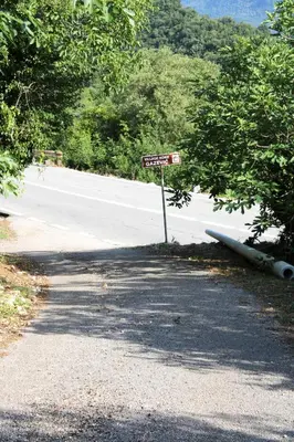 a street sign on the side of a road at Holiday Home Gazevic in Virpazar